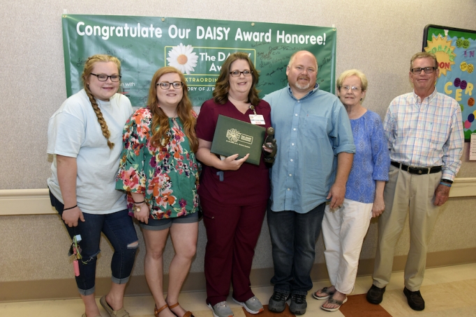 Nurse Lisa Pate with her family following the award presentation for McLeod's July DAISY Award