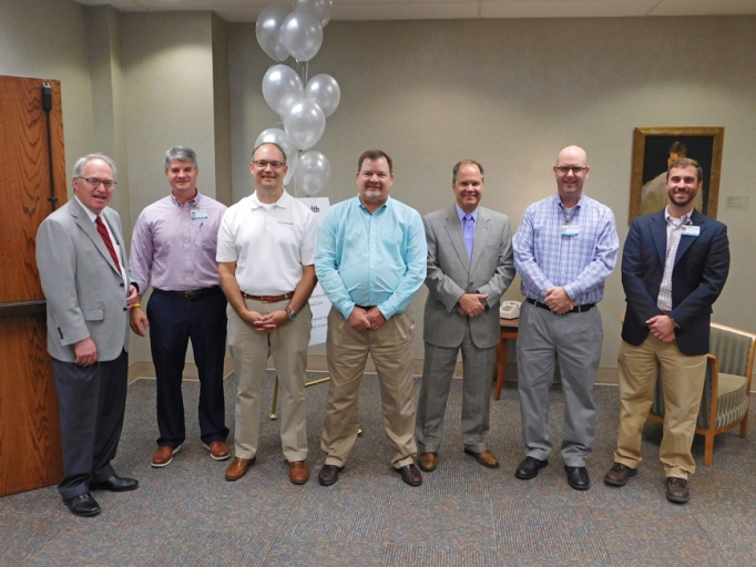 The founding and current physicians of Medical Plaza Family Medicine, as well as McLeod Health officials, celebrating the practice's 25th anniversary