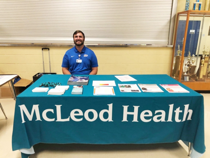 McLeod Sports Medicine Athletic Trainer Tyler Saylor giving information on what an athletic trainer’s role is at a school.=