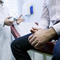A male patient talking to a doctor